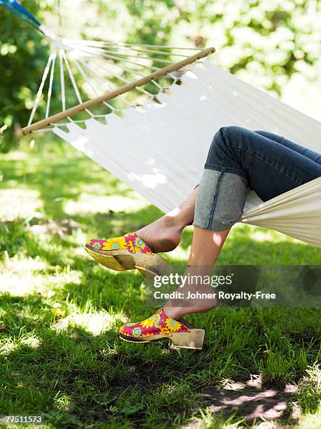 woman resting in a hammock stockholm sweden. - svensk sommar bildbanksfoton och bilder