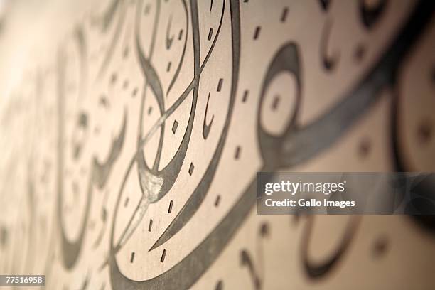 close up of decorative calligraphy. dubai, united arab emirates - dubai buildings stock-fotos und bilder