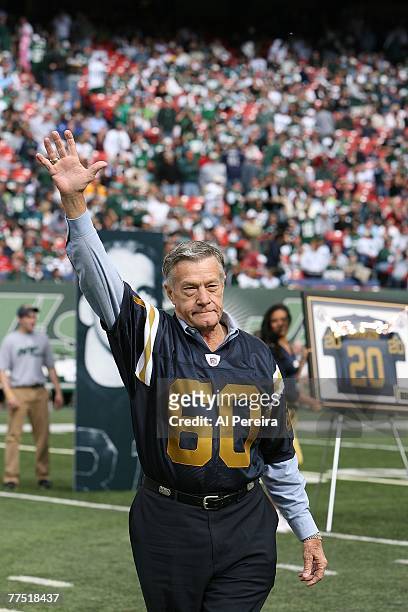 Former Linebacker Larry Grantham waves to the crowd as the New York Jets honored four of their original New York Titans players who also played on...