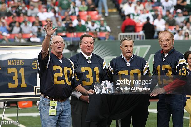 Former Titans/Jets Curley Johnson, Bill Mathis, Larry Grantham and Don Maynard wave to the crowd as the New York Jets honored four of their original...