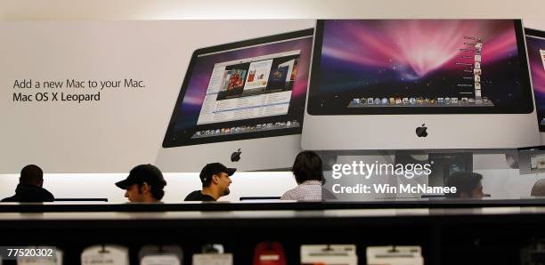 Customers look to purchase the new Apple computer operating system known as Leopard at an Apple store October 26, 2007 in Arlington, Virginia....