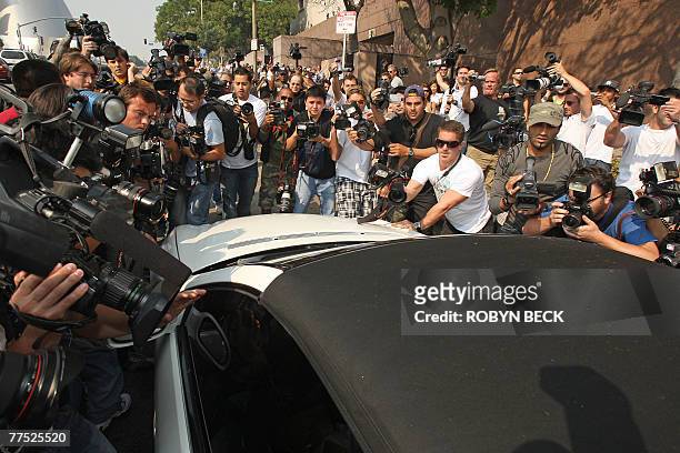 Photographers mob Britney Spears' car as she arrives at Family Court for a hearing to work out custody arrangements with her ex-husband Kevin...