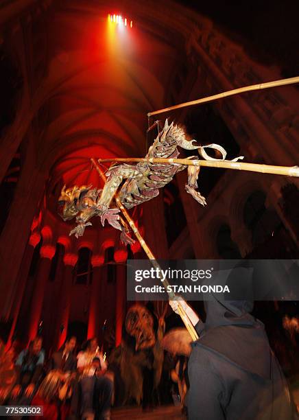 Creature is carried aloft during the "Halloween Extravaganza & Procession of the Ghouls", 26 October 2007, in The Cathedral Church of St. John the...