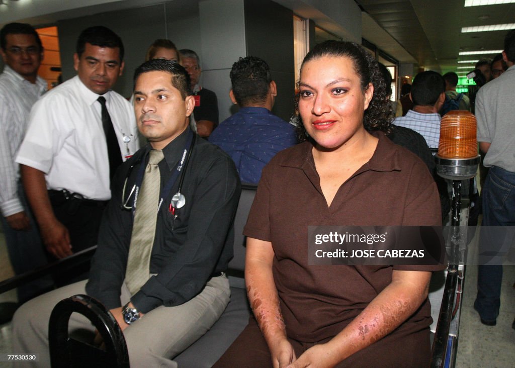 Nohemi Estela Martinez (R) rides in a ca