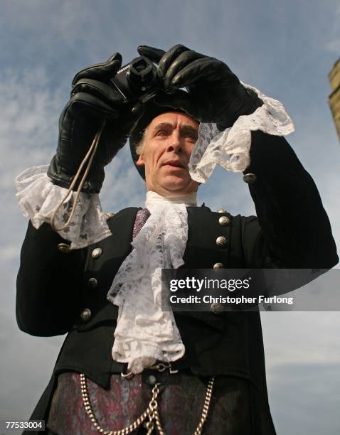 Ron Mcglone, dressed in gothic style, takes photographs at a renewal of marriage vows service for Goths Tony and Angela Lightowler, at St Mary The...