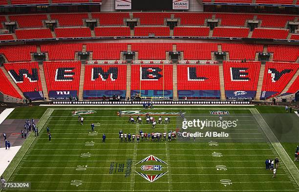 The New York Giants practice during the final walk through before their game against the Miami Dolphins on October 27, 2007 at Wembley Stadium in...