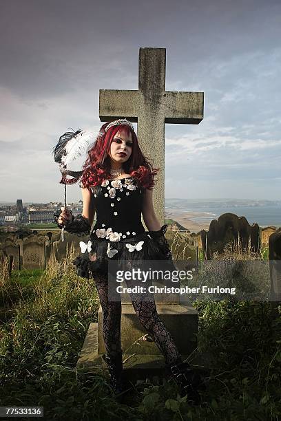 Goth Azadeh poses for a group of photographers during Whitby Gothic Weekend on October 27, 2007 in Whitby, England. Whitby Gothic Weekend which...