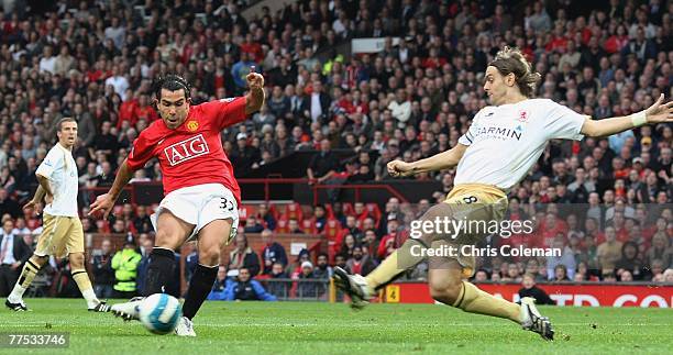 Carlos Tevez of Manchester United scores their third goal during the Barclays FA Premier League match between Manchester United and Middlesbrough at...