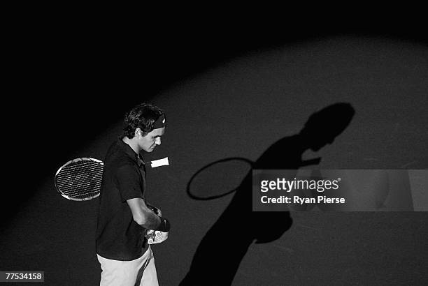 Roger Federer of Switzerland walks onto the court before his Semi Final singles match against Ivo Karlovic of Croatia during Day Five of the ATP...