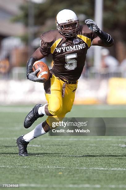 October 6: Devin Moore the University of Wyoming Cowboys carries the ball against the Texas Christian University Horned Frogs at War Memorial...