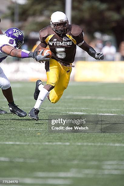 October 6: Devin Moore of the University of Wyoming Cowboys on the field against the Texas Christian University Horned Frogs at War Memorial Stadium,...