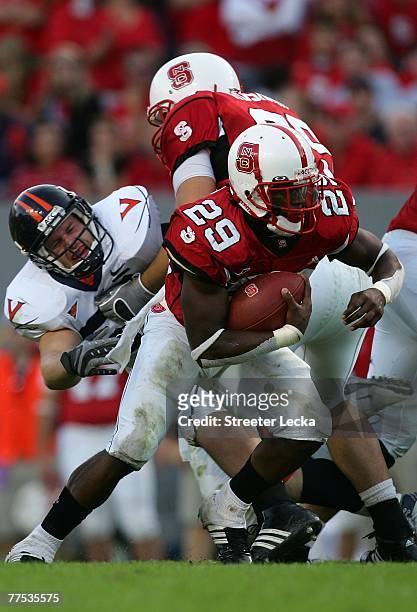 Jamelle Eugene of the North Carolina State Wolfpack runs with the ball against the Virginia Cavaliers during their game at Carter-Finley Stadium...