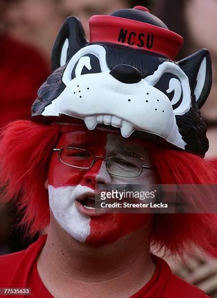 Fan of the North Carolina State Wolfpack watches their game against the Virginia Cavaliers at Carter-Finley Stadium October 27, 2007 in Raleigh,...