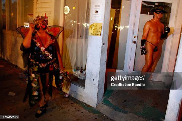 Revelers participate in the Fantasy Fest Masquerade March October 27, 2007 in Key West, Florida. The ten day costuming and masking festival ends...
