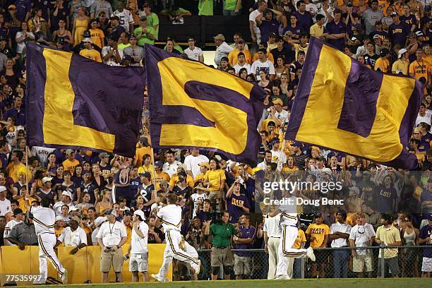 Cheerleaders of the LSU Tigers carries flags against the Florida Gators at Tiger Stadium on October 6 , 2007 in Baton Rouge, Louisiana. LSU defeated...