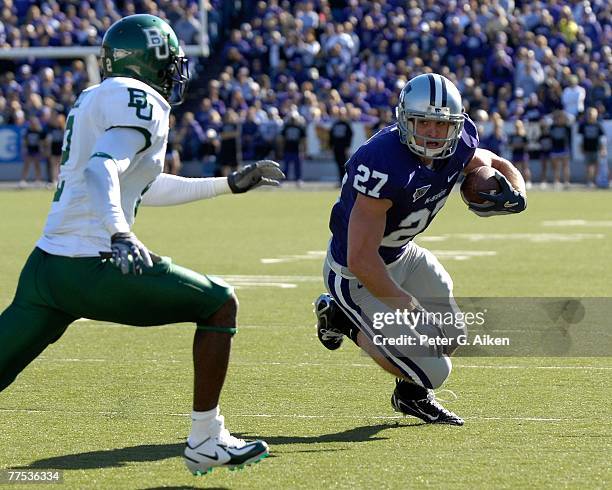 Wide receiver Jordy Nelson of the Kansas State Wildcats rushes up field after making a catch in the first quarter against pressure from defensive...