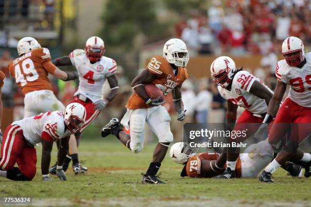 Running back Jamaal Charles of the Texas Longhorns sprints to a 40-yard touchdown through a gap in the Nebraska Cornhuskers defense at Darrell K...