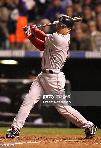 Drew of the Boston Red Sox hits a double against the Colorado Rockies during the fifth inning of Game Three of the 2007 World Series at Coors Field...