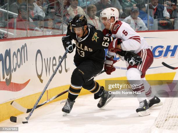 Center Mike Ribeiro of the Dallas Stars drives past defenseman Matt Jones of the Phoenix Coyotes on October 27, 2007 at Jobing.com Arena in Glendale,...