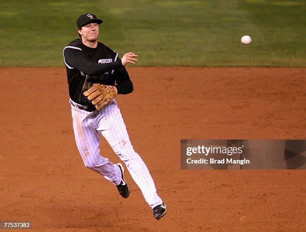 Infielder Troy Tulowitzki of the Colorado Rockies fields a ground ball out against the Boston Red Sox during the eighth inning of Game Three of the...