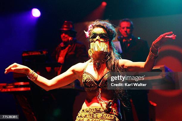 Belly dancer performs in the foreground while Rob Garza and Eric Hilton of Thievery Corporation spin during the Vegoose music festival at Sam Boyd...