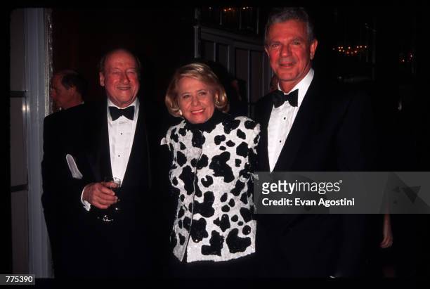 Journalists Osborn Elliott, Liz Smith and Peter Rogers stand together at the New Yorkers for New York awards dinner February 20, 1996 in New York...