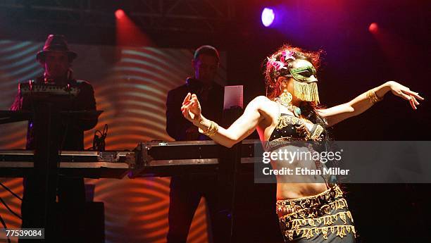 Dancer performs in front of Rob Garza and Eric Hilton of Thievery Corporation during the Vegoose music festival at Sam Boyd Stadium's Star Nursery...