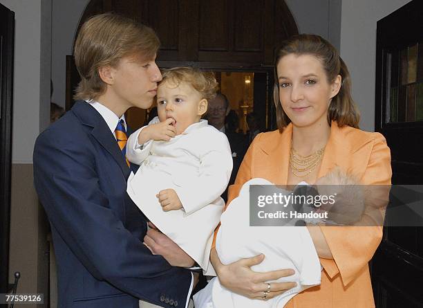 In this handout photograph issued on October 27, Prince Louis of Luxembourg poses with his son Gabriel of Nassau, his wife Tessy of Nassau and Prince...