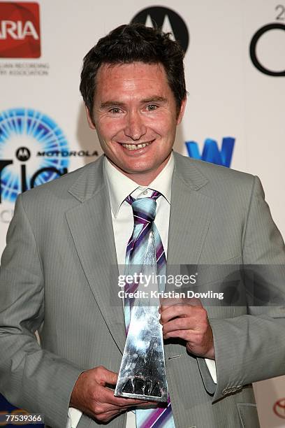 Comedian Dave Hughes poses backstage in the Awards Room with the award for Best Comedy Release for "Dave Huges - Live" at the 2007 ARIA Awards at...