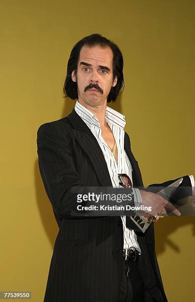 Singer Nick Cave poses backstage in the Awards Room with the Hall of Fame Inductee award recognisiing his career in music, at the 2007 ARIA Awards at...