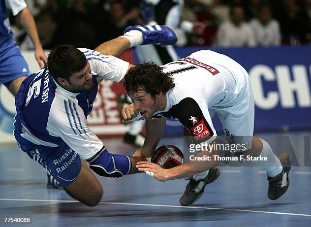 Torsten Jansen of Germany and Alexey Rastvortsev of Russia in action during the Handball QS Supercup match between Germany and Russia at the...