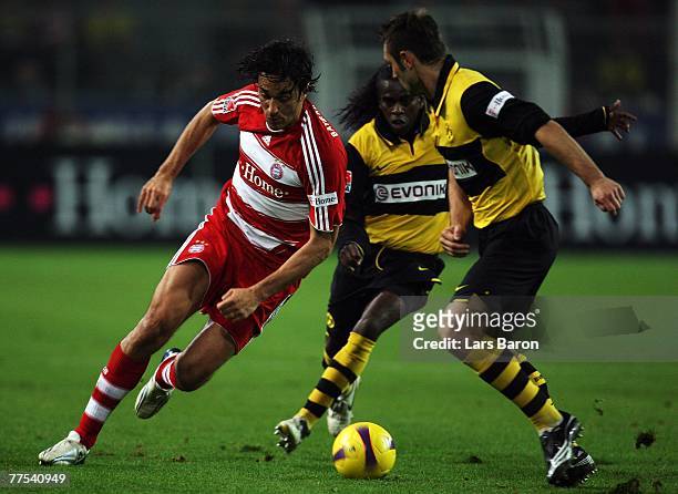 Luca Toni of Munich in action with Tinga and Robert Kovac of Dortmund during the Bundesliga match between Borussia Dortmund and Bayern Munich at the...