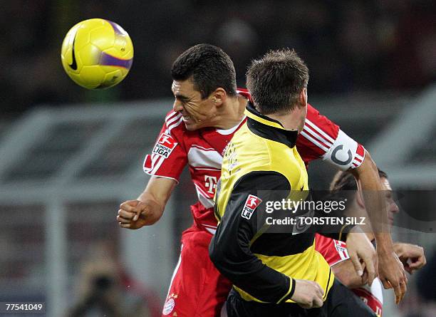 Bayern Munich's Brazilian defender Lucio and Dortmund's Polish midfielder Jakub Blaszczykowski vies for the ball during the German first division...