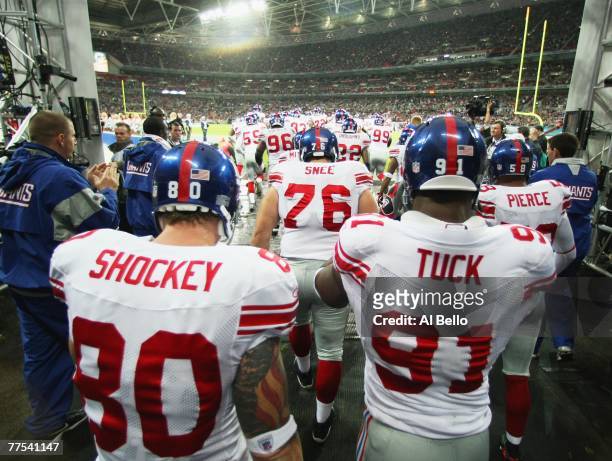 New York Giants players make their entrance prior to the NFL Bridgestone International Series match between New York Giants and Miami Dolphins at...
