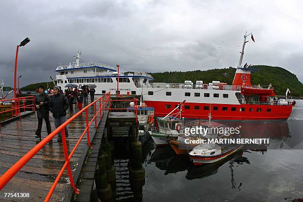 Tourists disembark from the cruise Skorpios in the small fishing town of Puerto Aguirre, in the Chilean Patagonia, 1500 km south of Santiago, on...