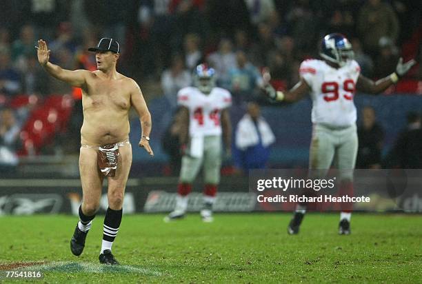 'Serial streaker' Mark Roberts runs onto the field of play during the NFL Bridgestone International Series match between New York Giants and Miami...