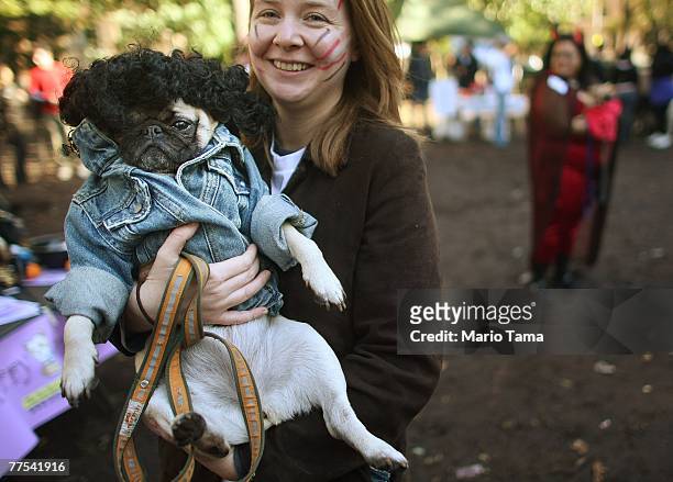 Kristin Kuster holds her dog Parker who poses as Michael Jackson's girlfriend in the "Thriller" video during the 17th annual Tompkins Square...