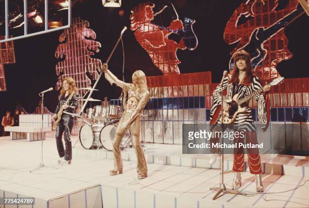 British glam rock group Sweet perform on stage on the Christmas Day edition of the BBC TV music show 'Top Of The Pops', broadcast 25th December 1973....