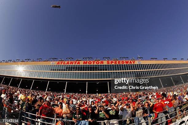 Fans watch race action during the NASCAR Nextel Cup Series Pepboys Auto 500 at Atlanta Motor Speedway on October 28, 2007 in Hampton, Georgia.