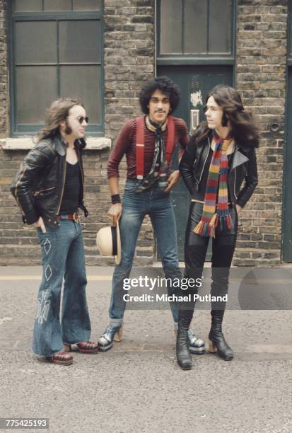 Irish rock group Thin Lizzy posed together in a street in London, 1974. Left to right: Brian Downey, Phil Lynott and Gary Moore .