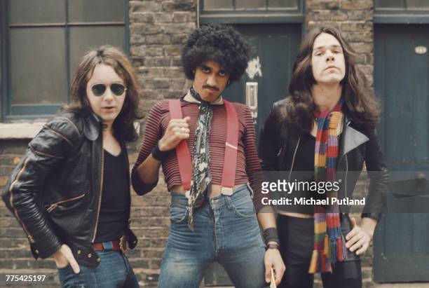 Irish rock group Thin Lizzy posed together in a street in London, 1974. Left to right: Brian Downey, Phil Lynott and Gary Moore .