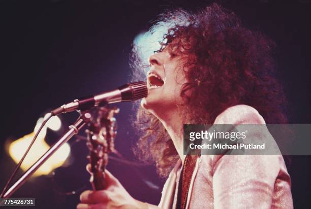 Singer Marc Bolan performing with English glam rock group T-Rex at a venue during a tour of the United Kingdom in 1972.