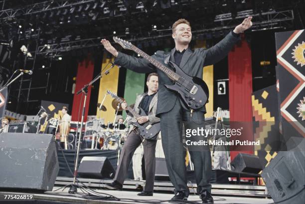English singer, musician and guitarist Ali Campbell of reggae band UB40 performs live on stage with brother Robin Campbell during the Nelson Mandela...