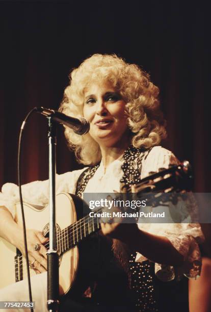American country singer and musician Tammy Wynette performs on stage at Theatre Royal, Drury Lane at the Royal Variety Performance, 8th November 1982.
