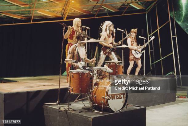 British glam rock group The Sweet perform on stage on the BBC TV music show 'Top Of The Pops' in London circa 1972. The group are, from left to...