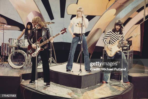 British glam rock group The Sweet perform on stage on the BBC TV music show 'Top Of The Pops' in London in 1974. The group are, from left to right,...