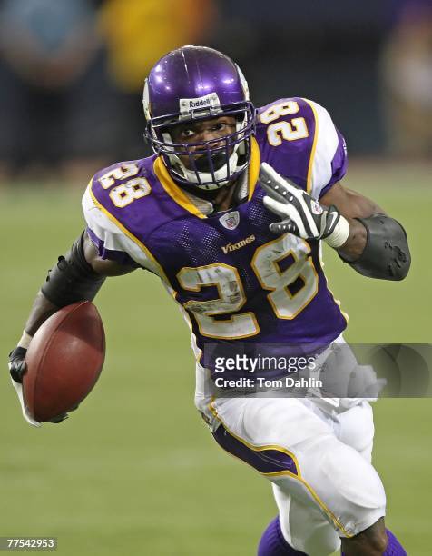 Adrian Peterson of the Minnesota Vikings carries the ball during an NFL game against the Philadelphia Eagles at the Hubert H. Humphrey Metrodome,...