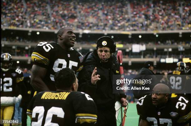 Pittsburgh Steelers defensive coordinator Dick Le Beau talks to linebacker Greg Lloyd and safeties Rod Woodson and Carnell Lake during the AFC...