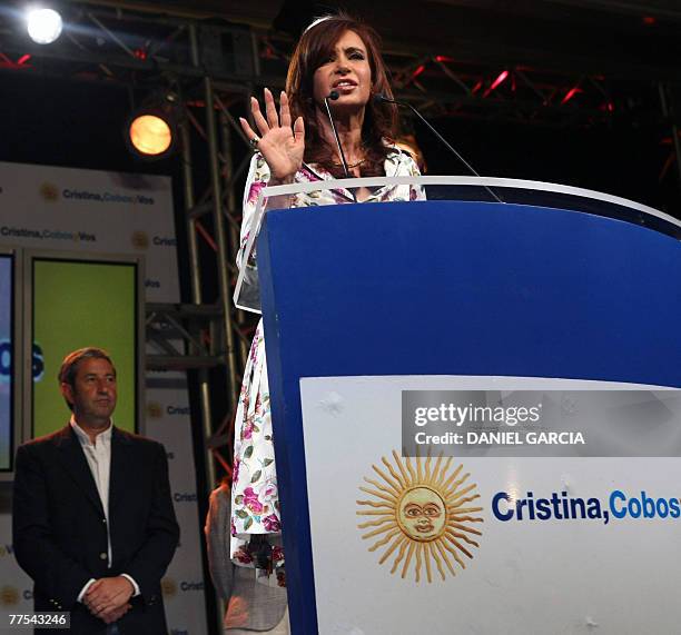 Argentina's newly elected president Cristina Fernandez de Kirchner delivers a speech while candidate for vicepresident Julio Cobos listens 28...