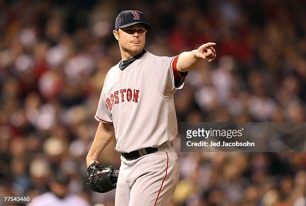 Starting pitcher Jon Lester of the Boston Red Sox points to first base during Game Four of the 2007 Major League Baseball World Series against the...